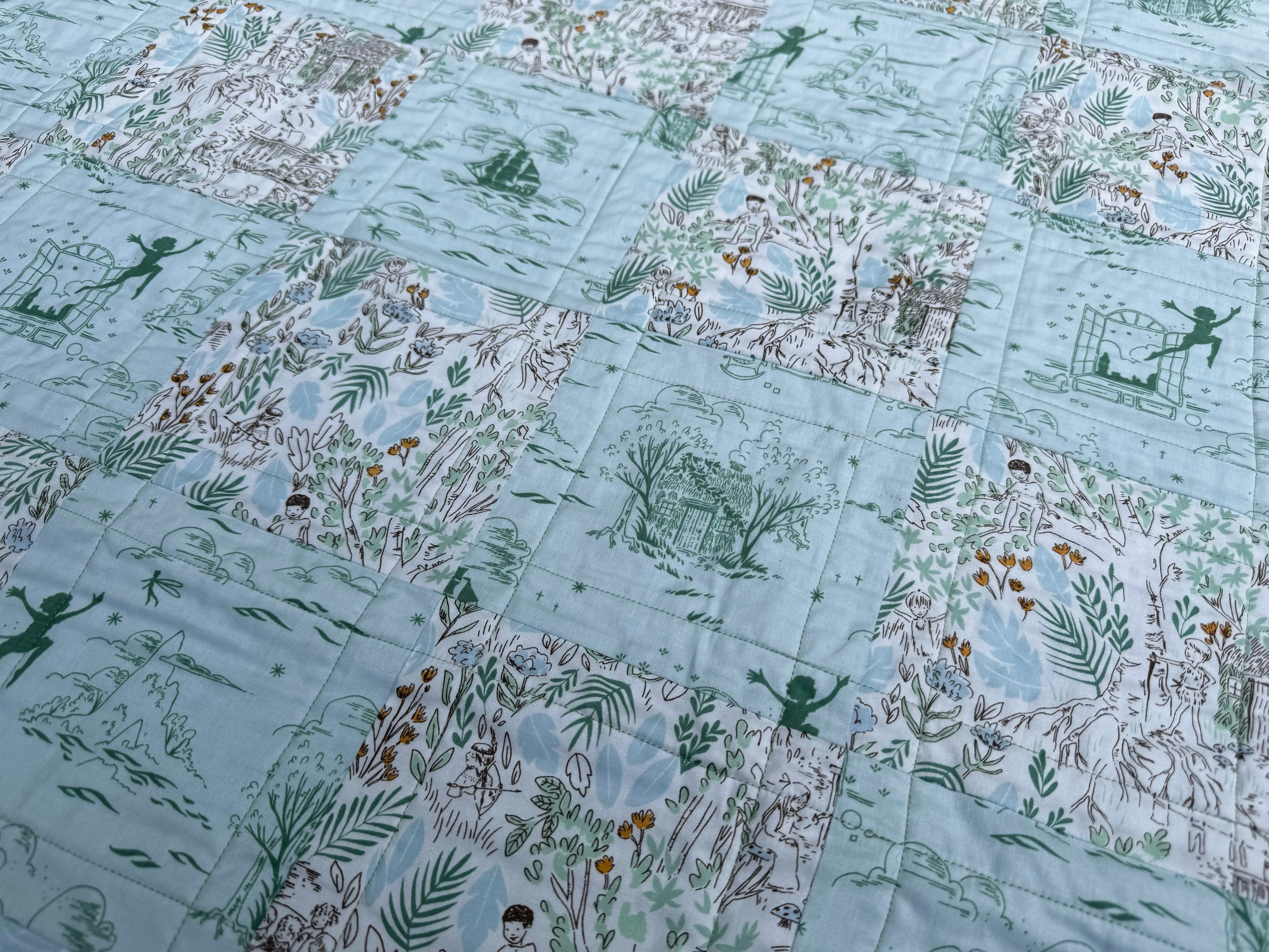 Peter Pan “Adventurine” Crib Quilt